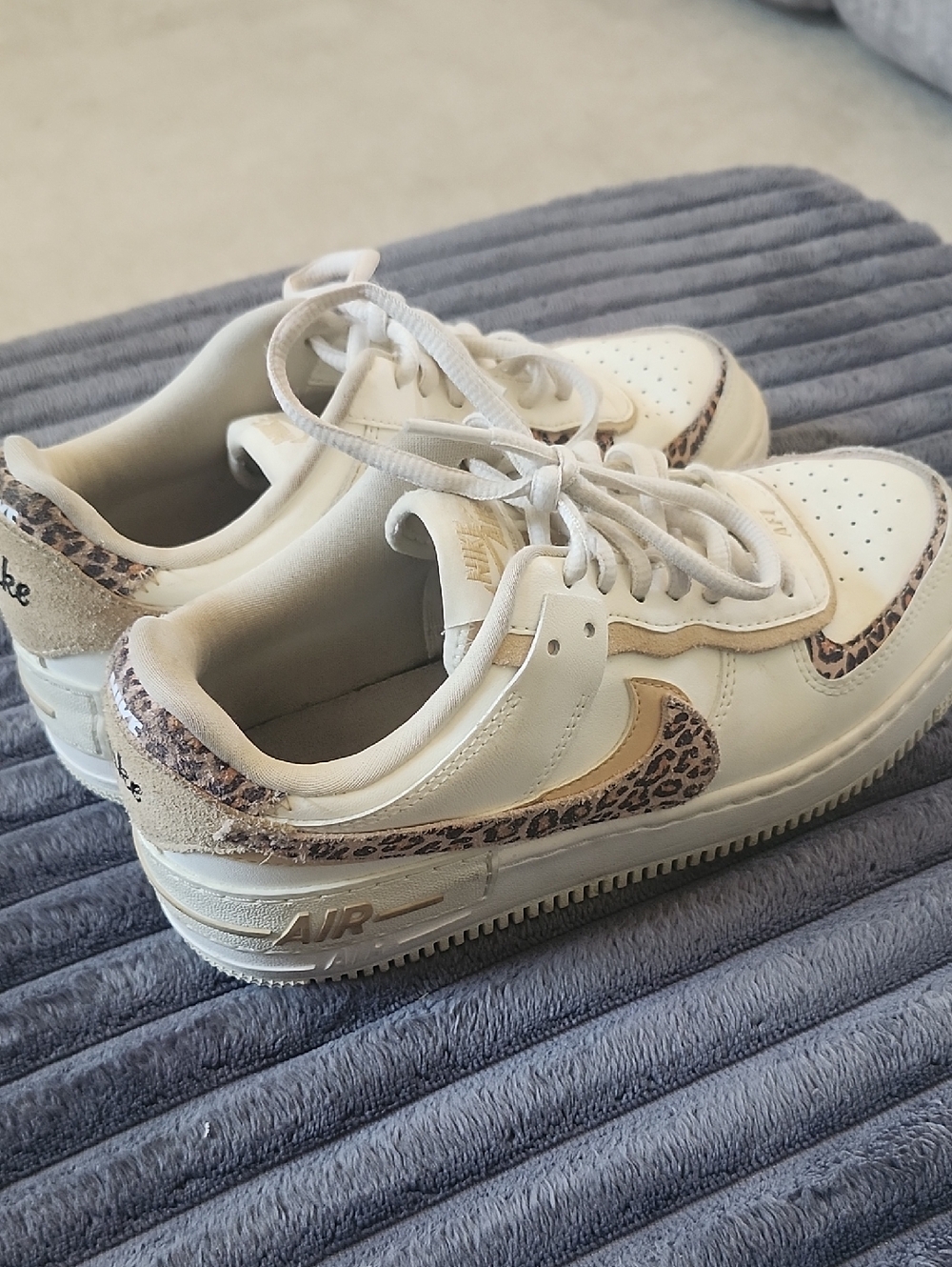 Nike White Sneakers with Leopard Swoosh and Beige Accents